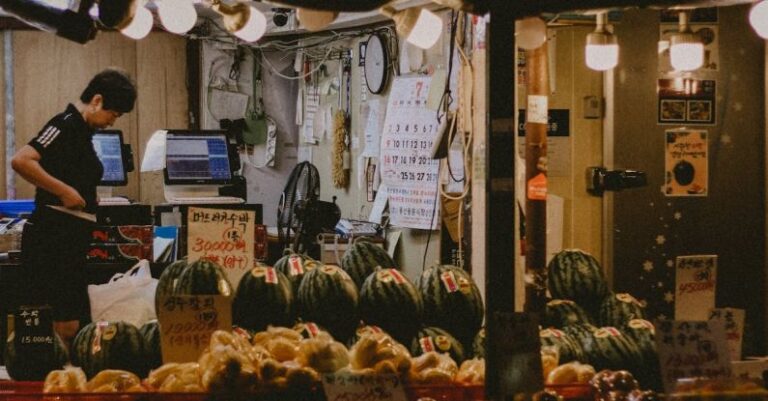 Omnichannel Retailing - A man is standing in front of a market stall