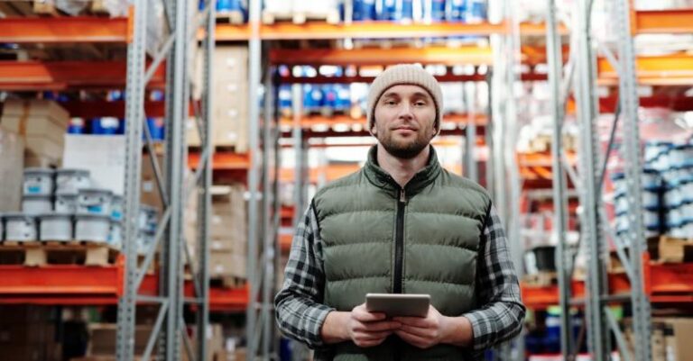 Logistics Management - Man in Bubble Jacket Holding Tablet Computer