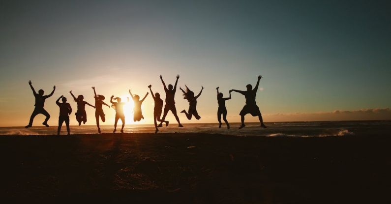 Team Building - Silhouette Photography of Group of People Jumping during Golden Time