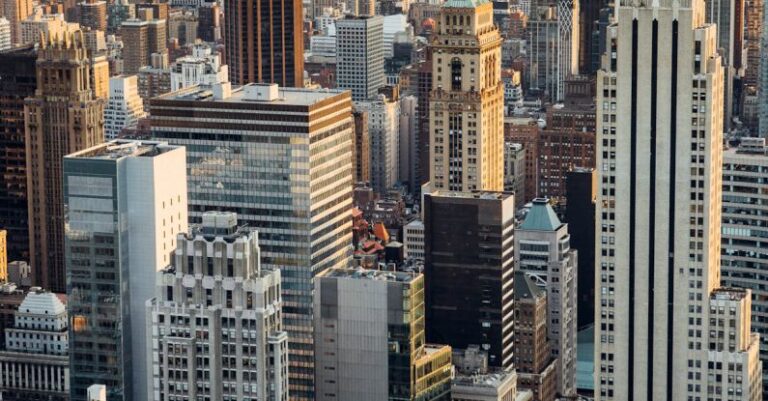 Real Estate Development - From above of downtown of megapolis with high rise financial and residential buildings located in New York City in daytime