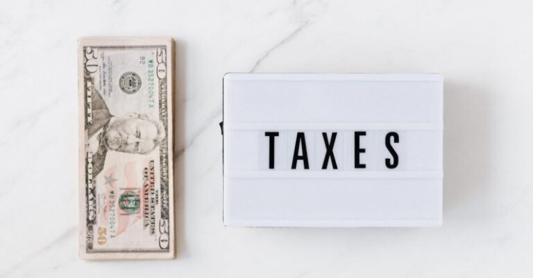 Government Policy - American dollar bills and vintage light box with inscription