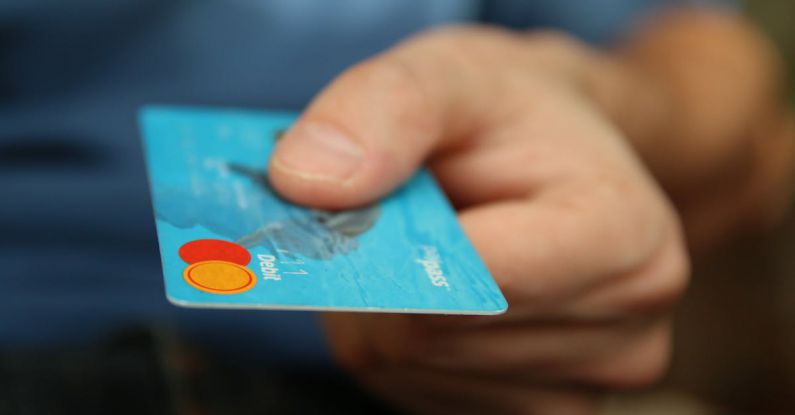 Corporate Financing - Person Holding Debit Card